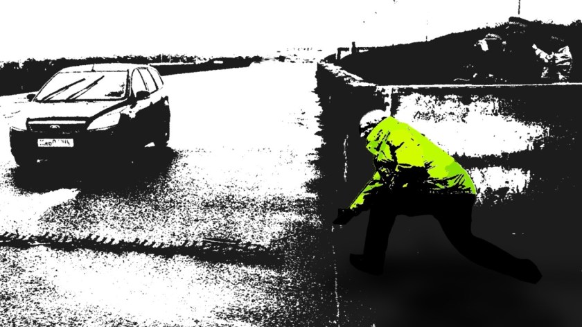 Police officers using a stinger device.