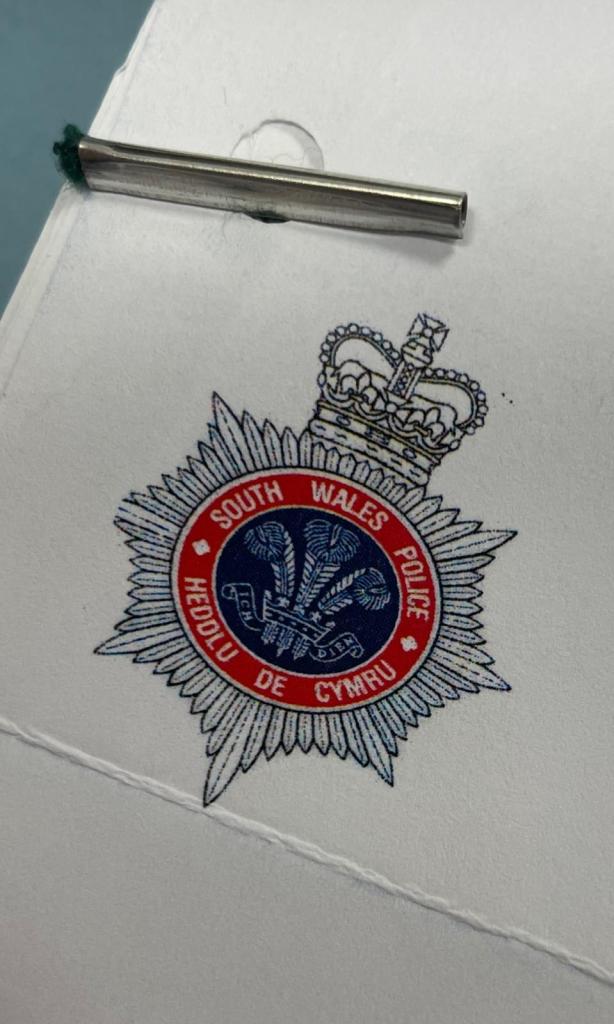 A photo of South Wales Police crest.